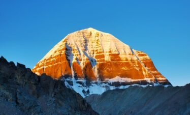 Stunning view of Mount Kailash illuminated by the sunrise, a majestic natural wonder.