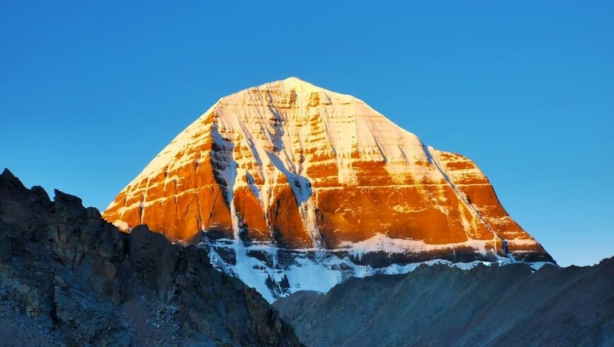 Stunning view of Mount Kailash illuminated by the sunrise, a majestic natural wonder.