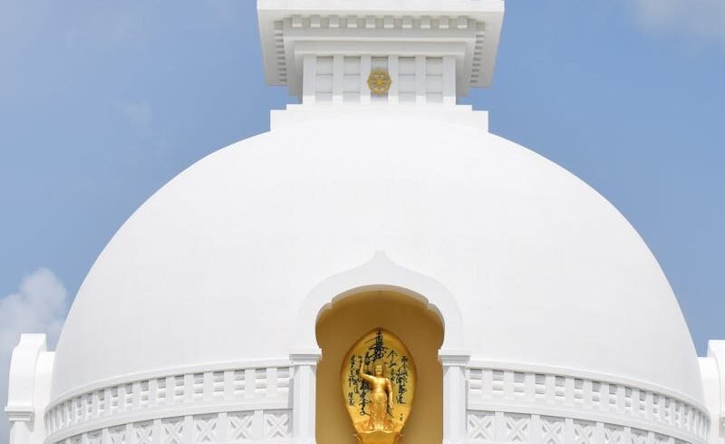 Breathtaking capture of Lumbini's iconic World Peace Pagoda against a clear sky.